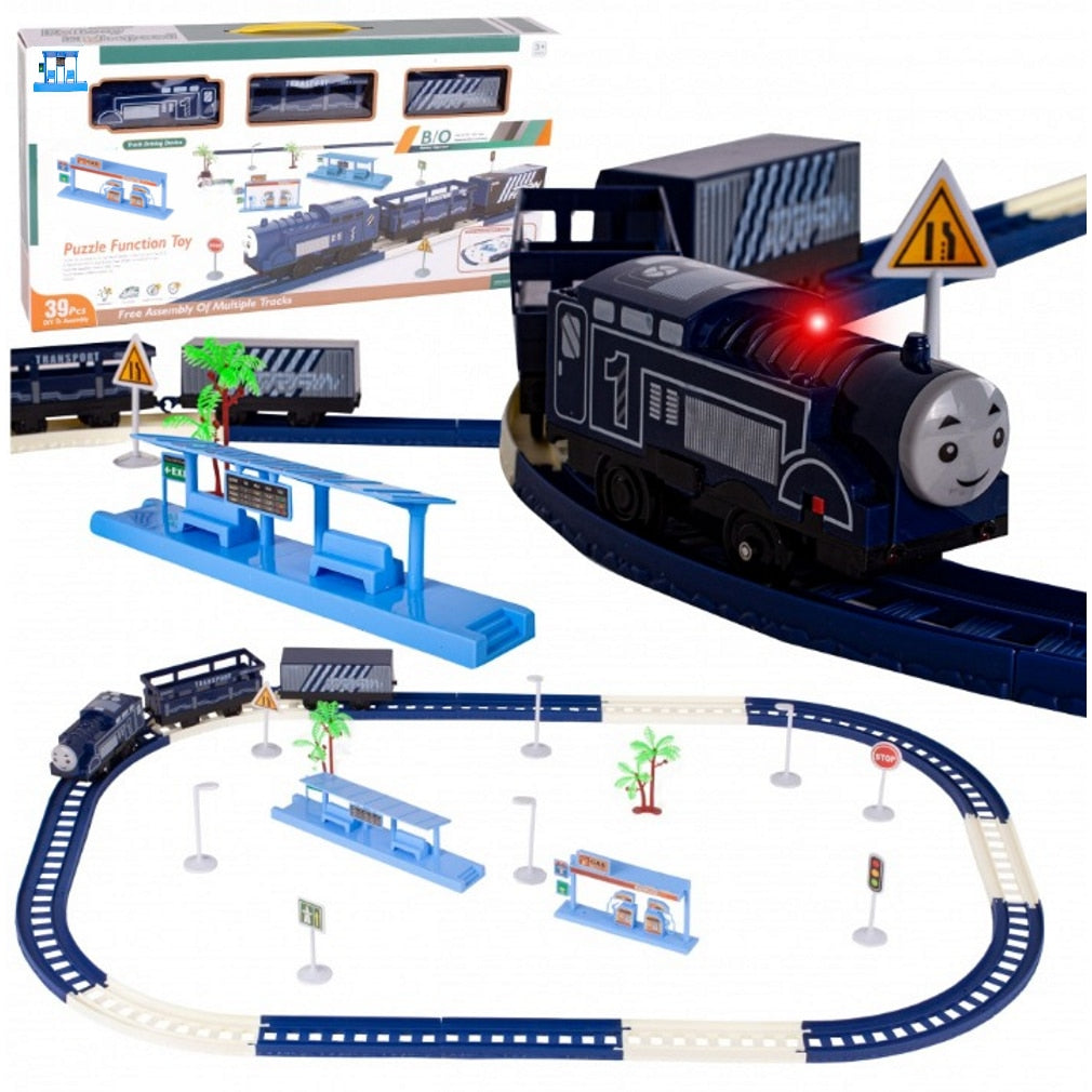 Circuit Electric Tren Railway High Speed idealSTORE, Accesorizat cu Sunete si Lumini, Include Trenulet, 2 Vagoane, Benzinarie, Platforma, 4 Lampi, 2 Copaci, 4 Indicatoare, 16 Elemente pentru a Crea o Pista, Lungime Pista 224 cm