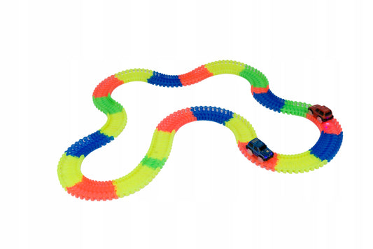 Set pista magica idealSTORE Fluorescent Track, Pista flexibila formata din 220 de elemente fluorescente, Include 3 masinute echipate cu luminite LED, Excelenta pentru orice varsta