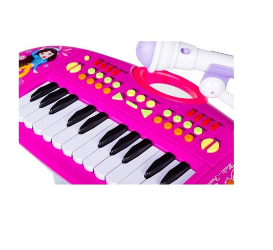 Orga Electronica cu Microfon si scaunel idealSTORE, Pink Hanna Singer, Dimensiuni 41 x 48 x 24 cm, Accesorizata cu 24 taste de Pian ce incurajeaza jocul de rol, Alb-Roz