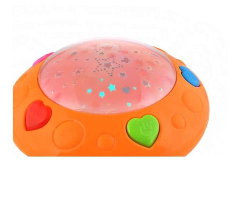 Lampa de veghe cu proiector idealSTORE Baby Dreams, Dimensiuni 16.5 x 15cm, Functie de detectare a vocii, Capacitatea de a schimba volumul, Include 12 melodii, Stimuleaza dezvoltarea abilitatilor si imbunatateste calitatea somnului