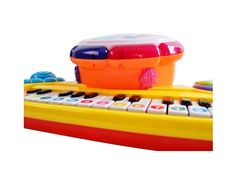 Pian interactiv 2 in 1 idealSTORE BABY ELEPHANT, Dimensiuni 35 x 20 x 11 cm, Echipat cu 14 melodii, Tobe, Stimuleaza imaginatia, Incurajeaza distractia si ajuta la invatarea vesela a cifrelor