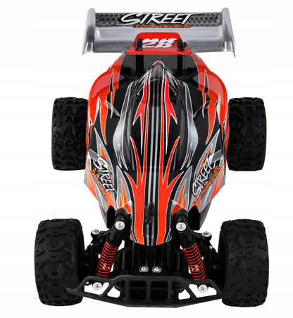 Masinuta cu Telecomanda si Suspensii OFFROAD Racing SPORT, Dimensiune 35 x 22 x 14 cm, Scara 1:16, Reglarea directiei rotilor, 4 amortizoare si un motor puternic permit depasirea pantei pana la 45, Viteza maxima 30 km/h, Negru-Portocaliu