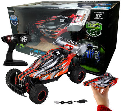 Masinuta cu Telecomanda si Suspensii OFFROAD Racing SPORT, Dimensiune 35 x 22 x 14 cm, Scara 1:16, Reglarea directiei rotilor, 4 amortizoare si un motor puternic permit depasirea pantei pana la 45, Viteza maxima 30 km/h, Negru-Portocaliu