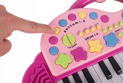 Orga Electronica Interactiva idealStore Let's Sing Pentru Copii, Portabila, Maner Confortabil, 29 Taste, 2 Difuzoare Incorporate, 8 Moduri Ritmice, 5 Melodii Preincarcate, Buton de Control al Volumului, Buton de Pornire/Oprire Roz
