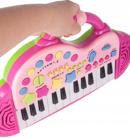 Orga Electronica Interactiva idealStore Let's Sing Pentru Copii, Portabila, Maner Confortabil, 29 Taste, 2 Difuzoare Incorporate, 8 Moduri Ritmice, 5 Melodii Preincarcate, Buton de Control al Volumului, Buton de Pornire/Oprire Roz