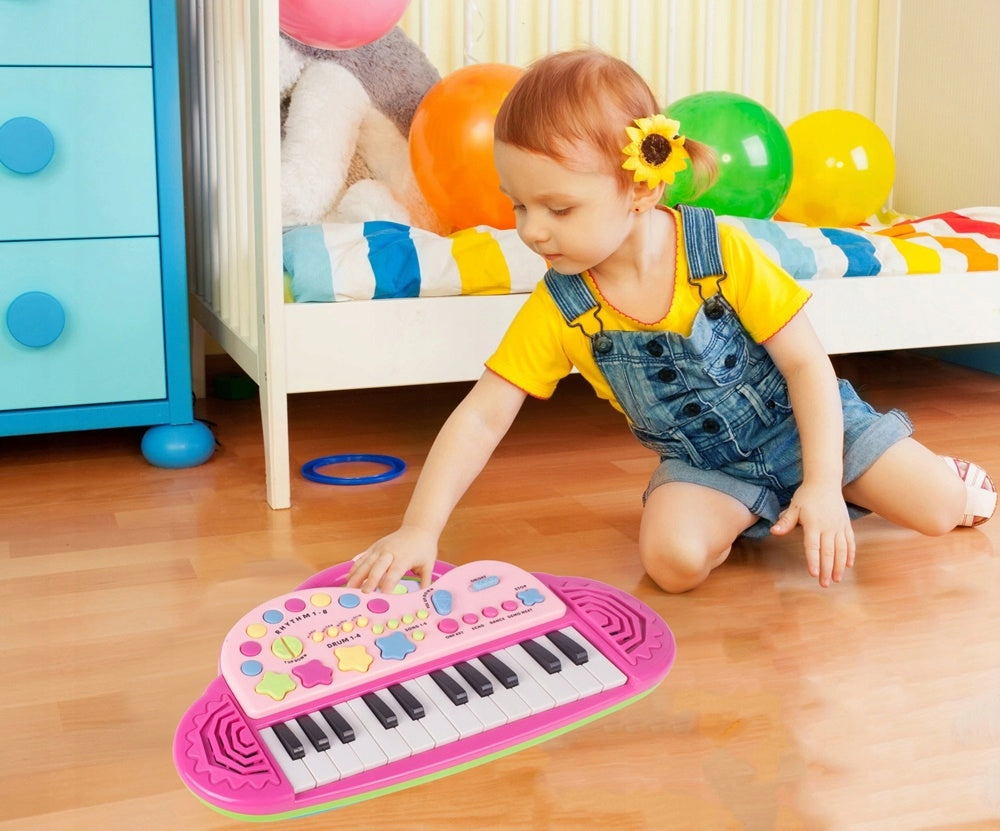 Orga Electronica Interactiva idealStore Let's Sing Pentru Copii, Portabila, Maner Confortabil, 29 Taste, 2 Difuzoare Incorporate, 8 Moduri Ritmice, 5 Melodii Preincarcate, Buton de Control al Volumului, Buton de Pornire/Oprire Roz