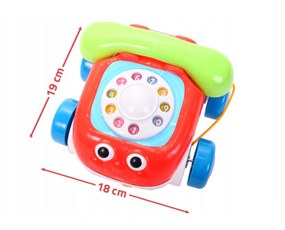 Telefon interactiv pentru copii IDL, MERRY KIDS PHONE, Dimensiuni 19 x 18 x 12 cm, Echipat cu roti si snur pentru plimbari ideale, Vesel si colorat invita copii la joaca