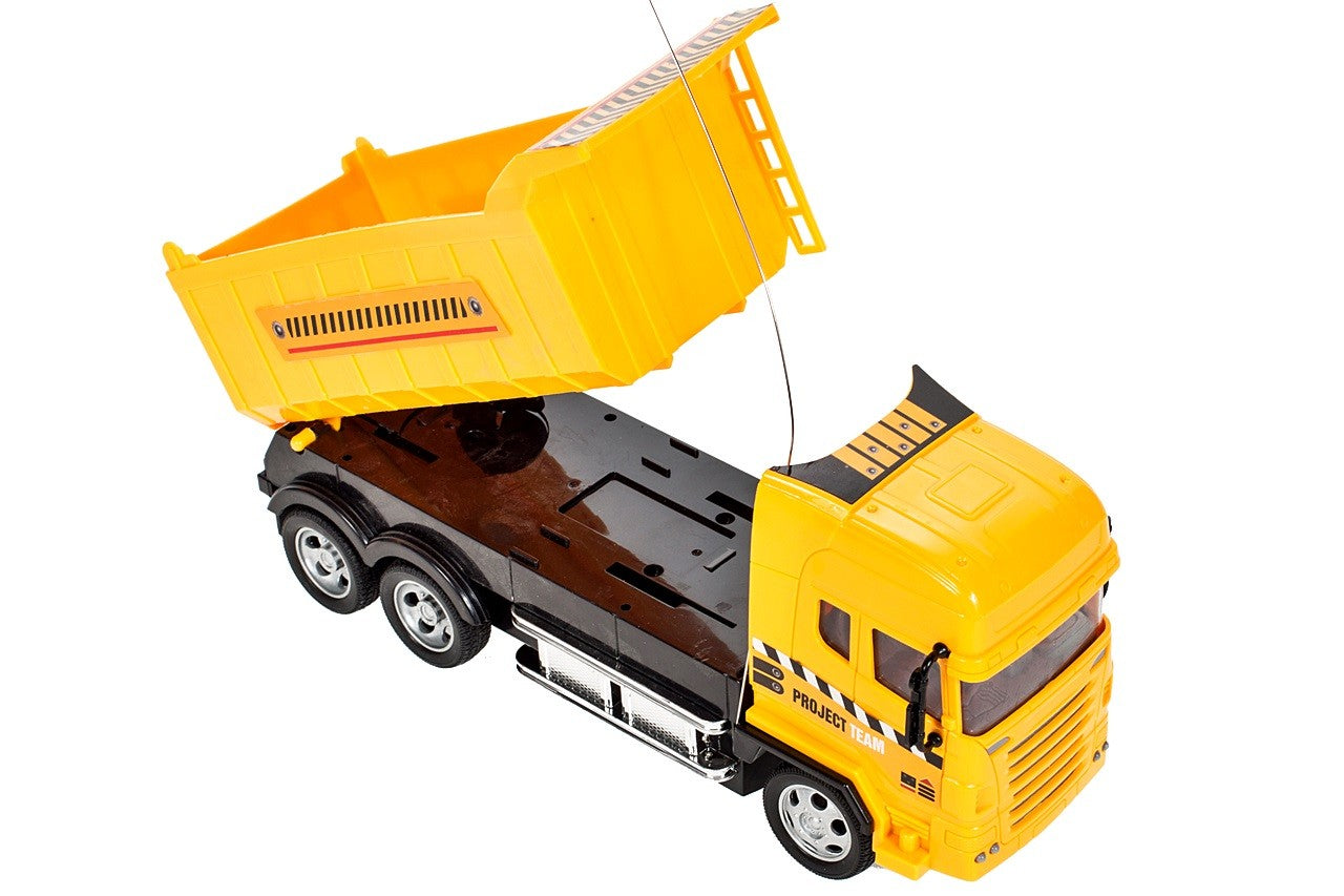 Camion interactiv idealSTORE, DIMENSIUNI 25 x 8 x 12 cm, Control la distanta pentru 4 canale, Autobasculanta mobila, Prag reglabil al rotilor din fata, O incantare pentru orice copil pasionat de masini