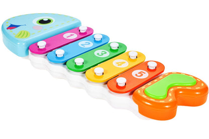 Xilofon Muzical Piranha Fish, 24 cm lungime, Permite dezvoltarea abilitatilor muzicale ce creaza o aventura a sunetelor, Instrument muzical in forma de pestisor ce stimuleaza coordonarea motorie si auditiva implicand multe simturi, Culoare-Multicolor