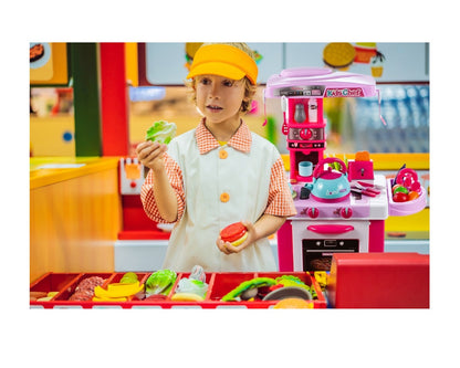 Bucatarie Multifunctionala pentru copii Candy JUNIOR CHEF, Inaltime 87 cm, Echipata cu accesorii simbolice, Reprezinta o parte integranta a echipamentului fiecarui tanar bucatar