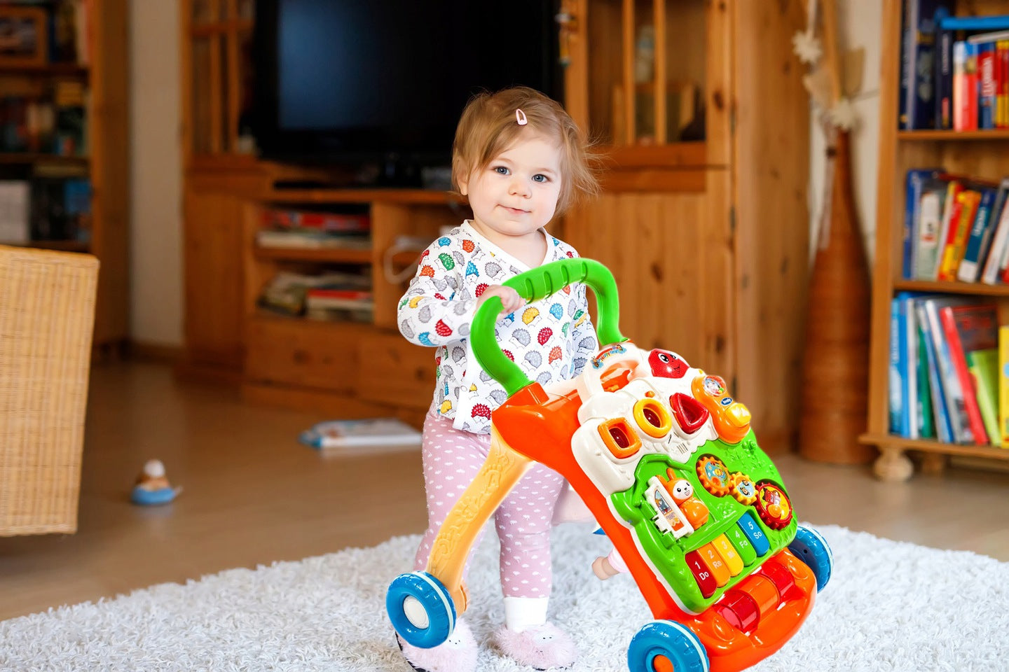 Premergator Interactiv BAMBI KIDS WALKER 2019, Echipat cu Panou Educativ detasabil, Activitati in limba engleza, Sunete si lumini, Sprijina dezvoltarea lingvistica si motorie a unui bebelus, Este un bun ajutor in invatarea mersului independent, Portocaliu