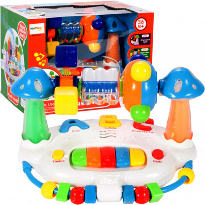 Jucarie interactiva cu pian idealSTORE Happy BELL, Dimensiuni 24 x 18 x 17 cm, Accesorizat cu o multitudine de functii, efecte sonore si piese in miscare, Sporeste imaginatia si imbunatateste relatia cauza-efect