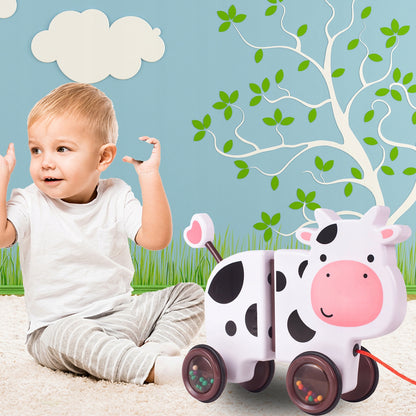 Jucarie interactiva Tip Vacuta Happy Cow idealSTORE, Dimensiune 18 x 19 x 9 cm, Dotata cu Sfoara Fabricat din plastic de inalta calitate, Roti inconjurate cu cauciuc, Pline cu bile, Posibilitatea de a se separa in 2 parti