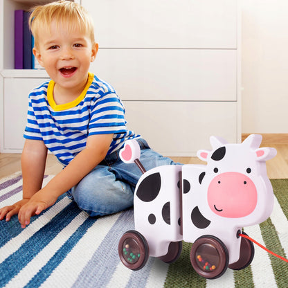 Jucarie interactiva Tip Vacuta Happy Cow idealSTORE, Dimensiune 18 x 19 x 9 cm, Dotata cu Sfoara Fabricat din plastic de inalta calitate, Roti inconjurate cu cauciuc, Pline cu bile, Posibilitatea de a se separa in 2 parti