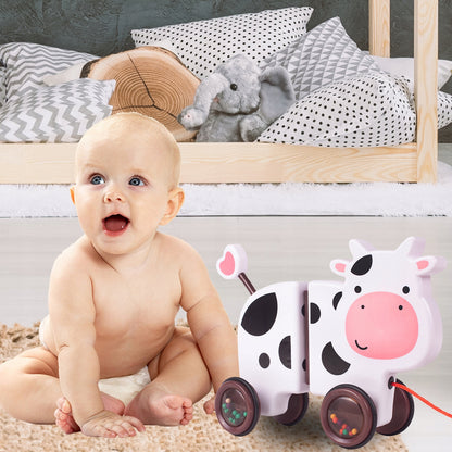 Jucarie interactiva Tip Vacuta Happy Cow idealSTORE, Dimensiune 18 x 19 x 9 cm, Dotata cu Sfoara Fabricat din plastic de inalta calitate, Roti inconjurate cu cauciuc, Pline cu bile, Posibilitatea de a se separa in 2 parti