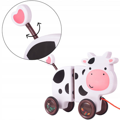 Jucarie interactiva Tip Vacuta Happy Cow idealSTORE, Dimensiune 18 x 19 x 9 cm, Dotata cu Sfoara Fabricat din plastic de inalta calitate, Roti inconjurate cu cauciuc, Pline cu bile, Posibilitatea de a se separa in 2 parti