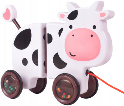 Jucarie interactiva Tip Vacuta Happy Cow idealSTORE, Dimensiune 18 x 19 x 9 cm, Dotata cu Sfoara Fabricat din plastic de inalta calitate, Roti inconjurate cu cauciuc, Pline cu bile, Posibilitatea de a se separa in 2 parti