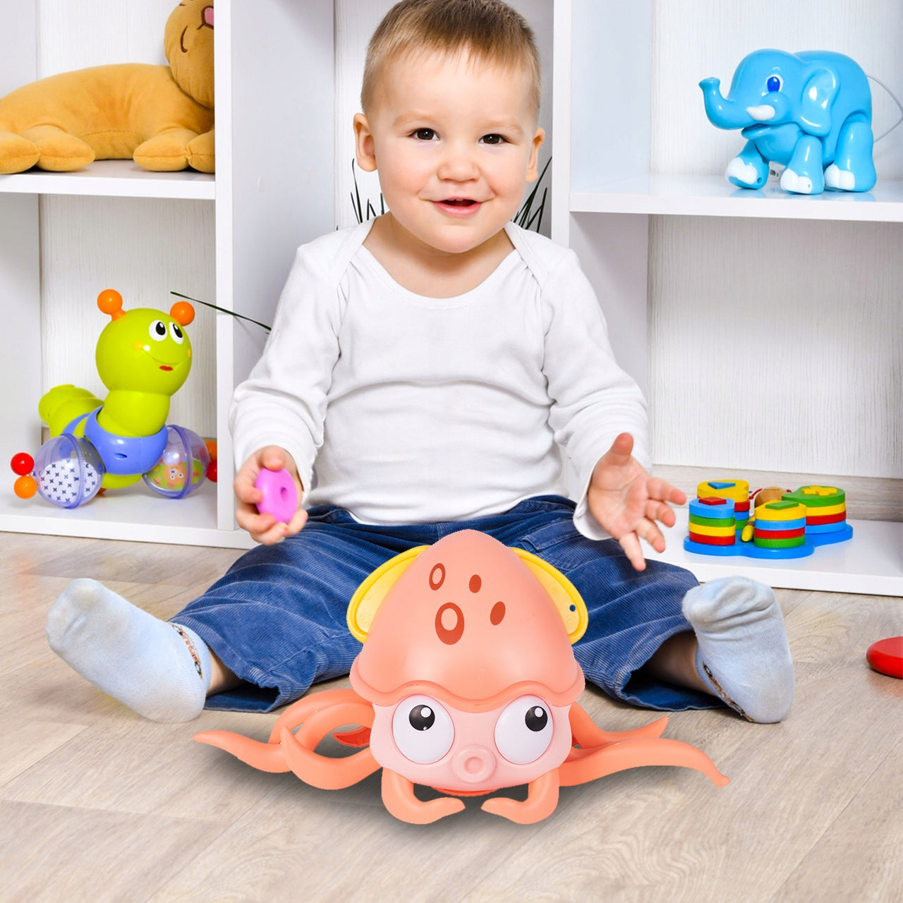 Caracatita interactiva Charming Octopus idealSTORE, Dimensiuni 25x11x13 Dotata cu Sfoara de tras Ajuta la dezvoltarea psiho-motorie a copilului, Culoare Roz