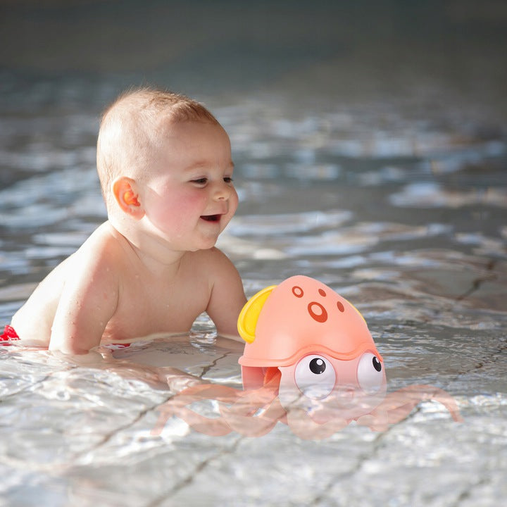 Caracatita interactiva Charming Octopus idealSTORE, Dimensiuni 25x11x13 Dotata cu Sfoara de tras Ajuta la dezvoltarea psiho-motorie a copilului, Culoare Roz