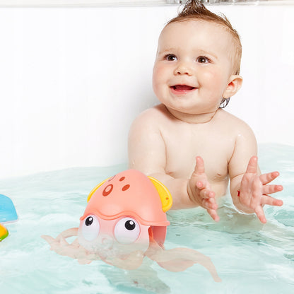 Caracatita interactiva Charming Octopus idealSTORE, Dimensiuni 25x11x13 Dotata cu Sfoara de tras Ajuta la dezvoltarea psiho-motorie a copilului, Culoare Roz