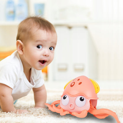 Caracatita interactiva Charming Octopus idealSTORE, Dimensiuni 25x11x13 Dotata cu Sfoara de tras Ajuta la dezvoltarea psiho-motorie a copilului, Culoare Roz