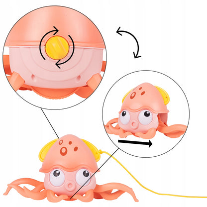 Caracatita interactiva Charming Octopus idealSTORE, Dimensiuni 25x11x13 Dotata cu Sfoara de tras Ajuta la dezvoltarea psiho-motorie a copilului, Culoare Roz