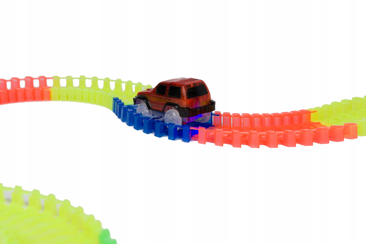 Set pista magica idealSTORE Fluorescent Track, Pista flexibila formata din 220 de elemente fluorescente, Include 3 masinute echipate cu luminite LED, Excelenta pentru orice varsta