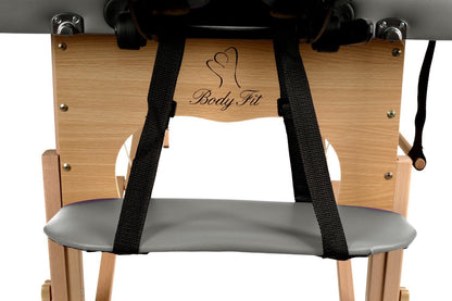 Masa de masaj pliabila idealSTORE, 2 segmente, Inaltime reglabila 62-84 cm, Piele ecologica moale, 2 cotiere laterale, Structura din lemn, Sarcina 250 KG, Rezistenta la uleiuri si apa, Include geanta de transport, Culoare Gri