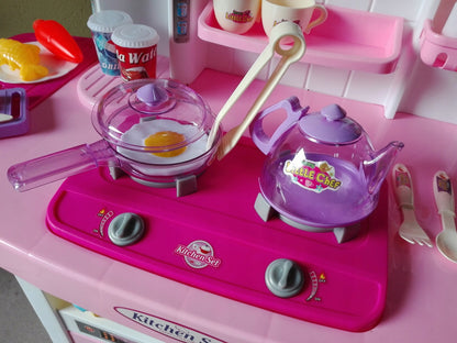 Bucatarie MULTIFUNCTIONALA IDL Candy Pink, 95 CM Inaltime, Efecte luminoase si sonore, Dotata cu accesorii simbolice: aragaz, frigider, cuptor, vesela, produse alimentare care SPORESC dezvoltarea ABILITATILOR de gospodar a orcarui copil, Roz