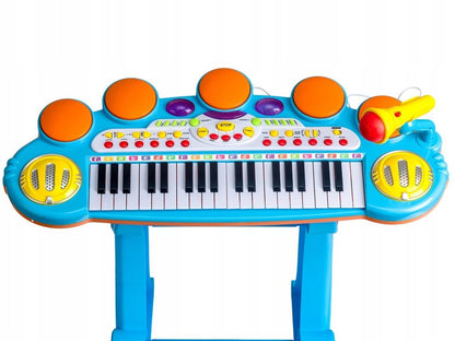 Orga cu Microfon si Scaunel idealSTORE, Glamour Piano, Dimensiuni 45 x 60 x 25 cm, Echipata cu 37 taste functionale, Lumini colorate, Dezvolta dexteritatea manuala, Albastra-Galben