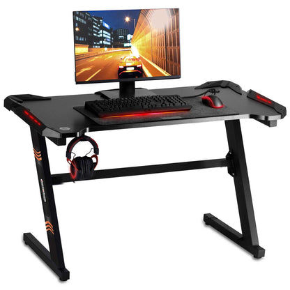 Birou gaming Smart Collection idealSTORE Dimensiuni 120 x 60 x 70 cm, Cadru metalic stabil, Iluminare LED, Accesorizat cu suport pentru casti, Picioare reglabile, Echipat cu sistem de gestionare a cablurilor, Culoare Negru