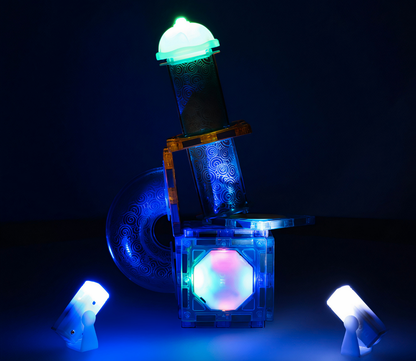 Set de constructie IdealStore, Blocuri magnetice luminoase, Pista cu bile stralucitoare, Dimensiune pachet 27 X 13 X 7.5 cm, Contine 49elemente, 4bile,20autocolante,16blocuri patrate, Dezvolta perfect motricitatea si precizia degetelor, Multicolor