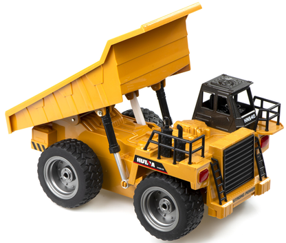 Camion Basculanta Dump Truck idealSTORE, Dimensiuni 28 x 15 x 16 cm, Include 6 Canale si Elemente Metalice, Accesorizat cu Sunete si Lumini LED, Anvelope din Cauciuc, Incarcare USB, Dezvolta Abiliatile Manuale