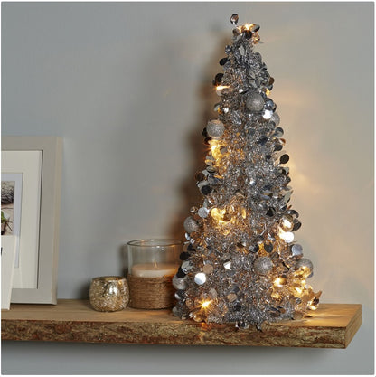 Mini Brad artificial elegant IDL cu Beteala, Inaltime 50 cm, Latime 20cm, Culoare Argintiu, Culoare Led Alb Cald, pentru o ambienta de neuitat in timpul sarbatorilor