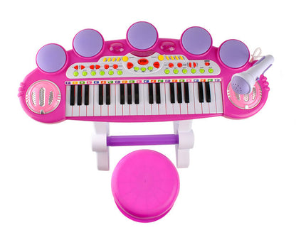 Centru de activitati Maestra Pianista cu Orga, Microfon, Scaunel, Melodii si Luminite, Difuzor incorporat, Dimensiuni 60 cm latime, 47 cm inaltime, Picioruse Antiderapante, Culoare Roz